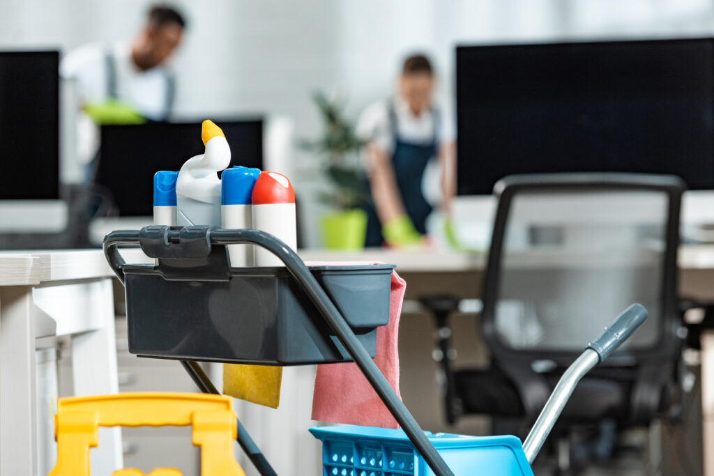 Selective,Focus,Of,Cart,With,Cleaning,Supplies,And,Two,Cleaners