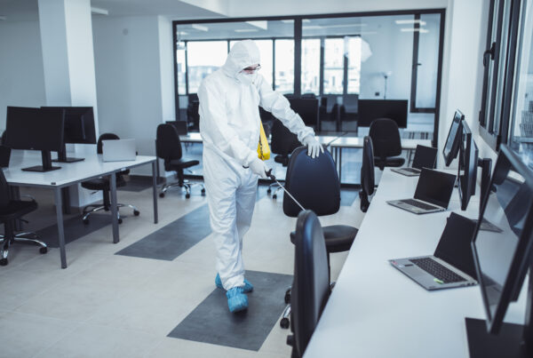 Office,Disinfection,During,Covid-19,Pandemic.,Man,In,Protective,Suit,And